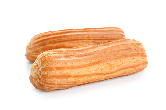 Delicious eclairs on white background