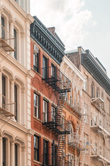 Fototapeta premium Street perspective of architecture in Tribeca Manhattan, New York City. SoHo, Chinatown, Financial District, Little Italy, Nolita