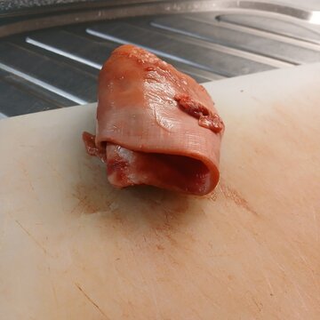 Gore ot uma. Surreal self-reflection of a human eye in a piece of raw meat.