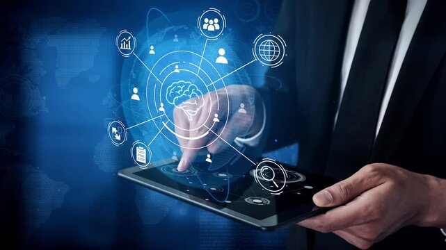 Businessman interacts with tablet, showcasing digital technology icons in a visual representation, symbolizing innovation, analytics, and connectivity in the modern workplace. Entropy.