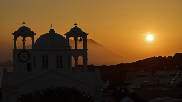 Church, orthodox, Greek Orthodox church, Agios Nikolaos church, a church appears against an orange sunset with sea view and mountains, Trypiti, Tripiti, village, Milos, island, Cyclades, Greek islands, Greece