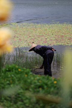 man working in a lake