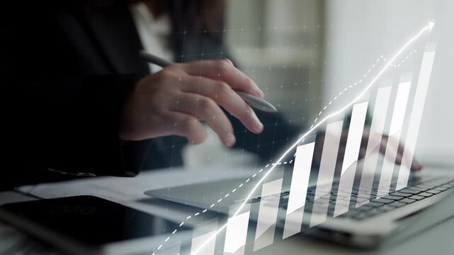 Businessperson engaged in data analysis on a laptop with visual growth charts, symbolizing innovation and strategic planning in a modern office setting. Copula