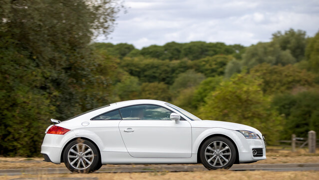 Milton Keynes; UK - Aug 22nd 2026:; 2013 white Audi tt sport tfsi car driving on a British road