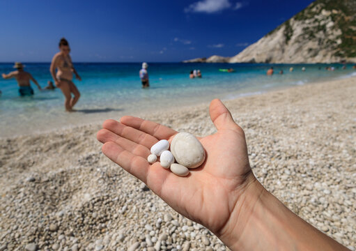 A photograph of the white pebbles typical of the beautiful, azure Paralia Petani beach