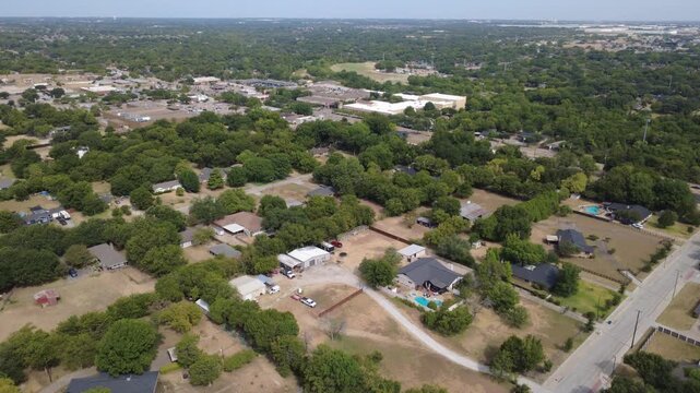Large residential acreage lots span natural wooded terrain near Ten Mile Creek park. Detached outbuilding barns, private swimming pools occupy tranquil open green grounds, DeSoto, Texas