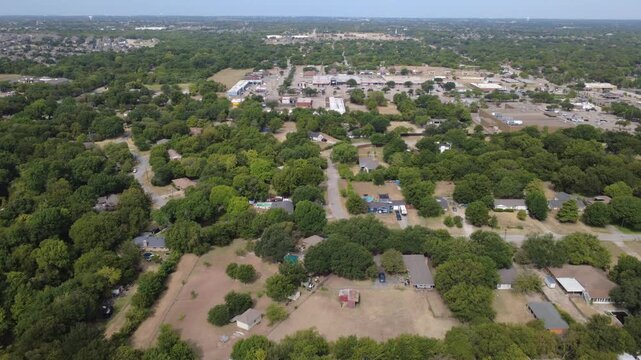 Wooded homestead acreage encompasses secluded private residences near Hampton Road. Custom swimming pools, rustic red metal barn outbuildings sit among dense foliage, DeSoto, Texas