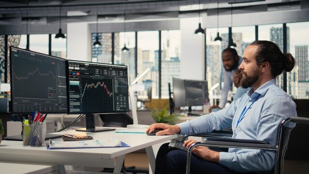 Day trader with disability analyzes stock market charts