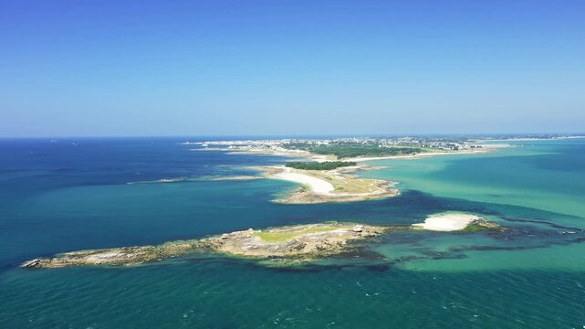 Aerial footage showcasing the Pointe du Conguel and the islet of Toul Bihan at the tip of the Quiberon Peninsula, Brittany, France. No people are visible in the scene.