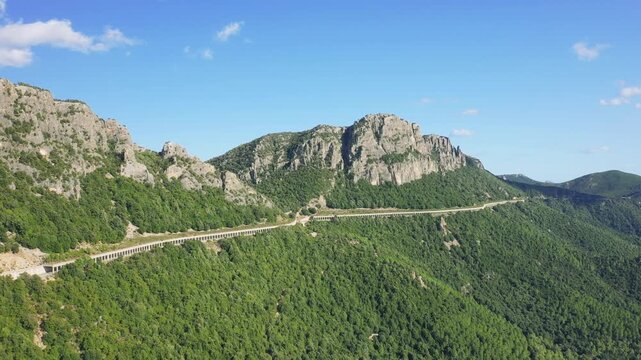 Aerial footage showing the scenic countryside around the town of Baunei in Sardinia, Italy.