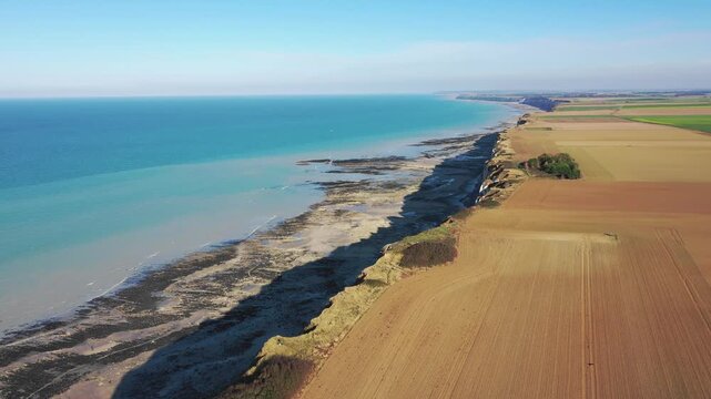 Aerial footage of the dramatic coastline near Saint-Valery-en-Caux in Normandy, France. No people or buildings are visible, emphasizing the unspoiled, rural character of the landscape.