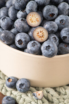 Fresh blueberries with water droplets in ceramic bowl