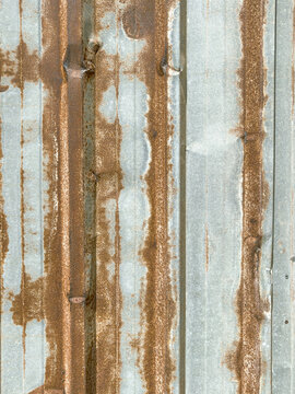 Rusty corrugated metal sheet background texture