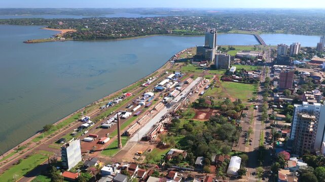 Close aerial view of rally event tents and staging structures on the waterfront.