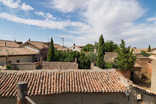 Urue&ntilde;a village rooftops with traditional terracotta tiles
