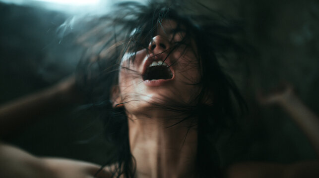 Distressed Young Woman Screaming in Anguish and Despair
