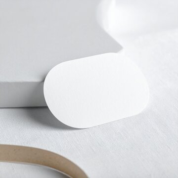 Blank rounded rectangle paper business card mockup on light background