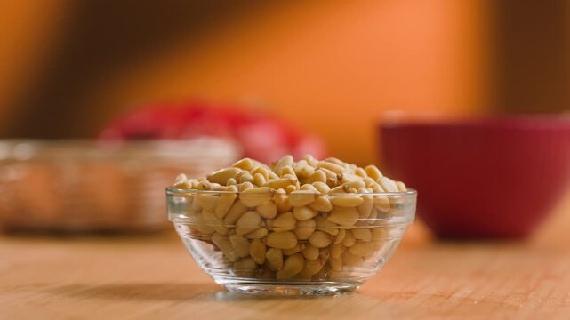 Pine Nuts Eaten by a Man, Person Cracking and Enjoying Fresh Cedar Pine Nuts as a Healthy Organic Snack