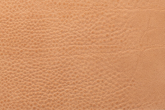 Close up of light tan or camel leather texture background