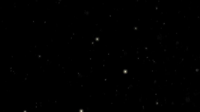 Numerous tiny white and off-white dots are randomly scattered across a deep, dark black background, resembling stars in an infinite cosmic void or subtle texture.