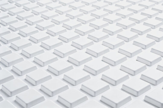 A neat grid of identical white square block-shaped elements arranged in orderly rows, forming a uniform geometric pattern.