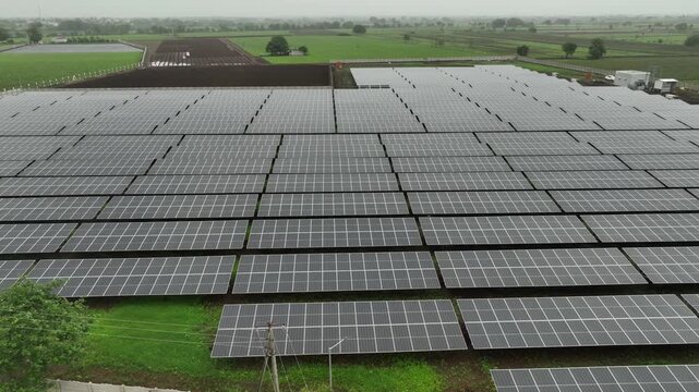 aerial drone view of solar panels provide green energy and high mega volts plant.4k video