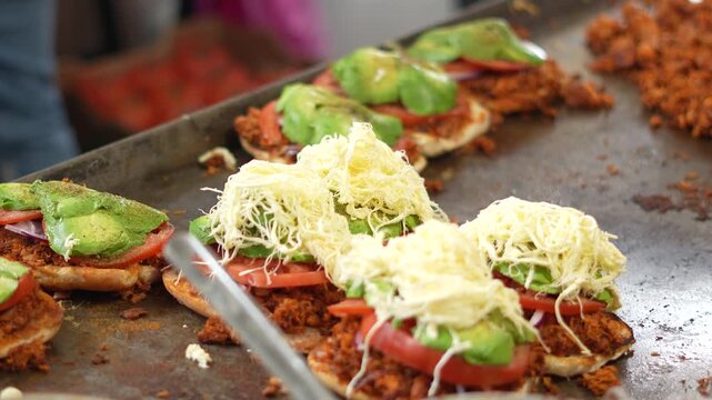 Close Up Shot Of Chef Adding Fresh Cheese On Famous Mexican Torta, Mexico