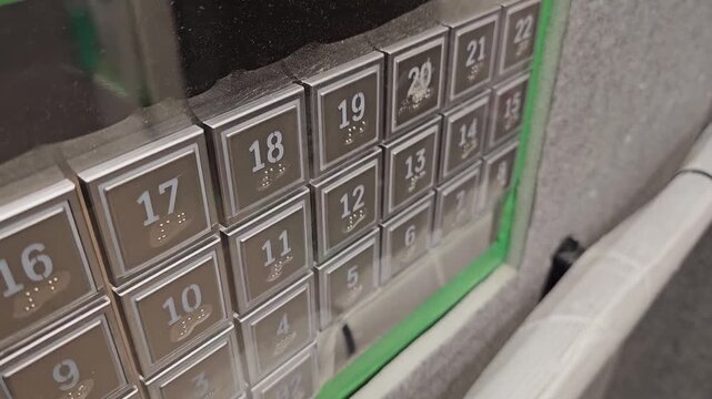 A video showing a button attached inside an elevator installed in an apartment, photographed