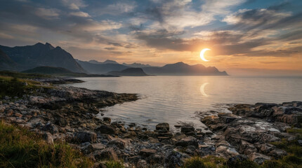 Obraz premium Partial solar eclipse illuminates rocky coastal shoreline and distant mountains with soft light reflecting on calm ocean water flow.