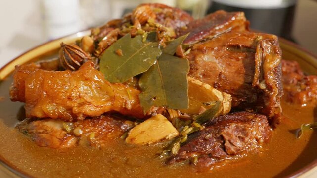 A big bowl of spiced braised beef soaking in rich broth.