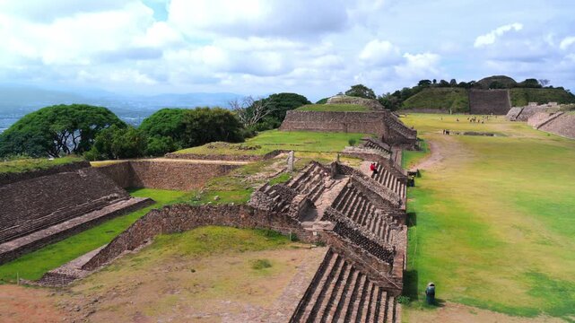 Beautiful panoramic view of the ancient ruins and pyramids at monte alban, a pre columbian archaeological site of the zapotec civilization, with the city of oaxaca visible in the background