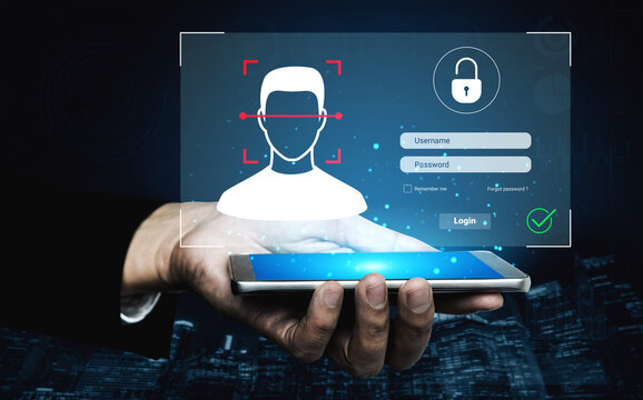 Close-up of a hand holding a smartphone showing a facial recognition login interface with a dark blue background, representing technology and security in digital authentication. Cyphers