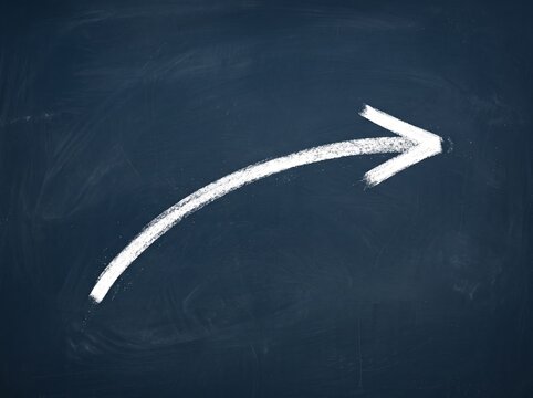 Single White Chalk Arrow on a Deep Blue Background