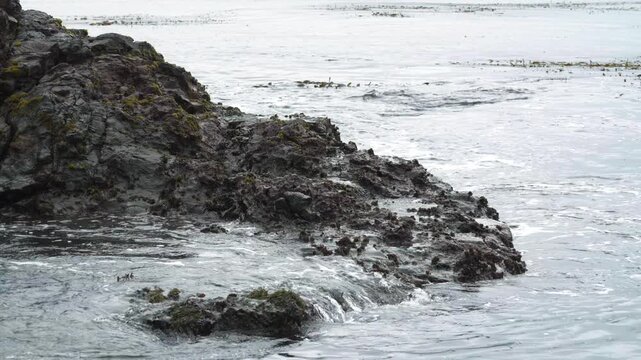 waves crashing against rocks 