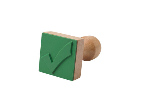 Wooden rubber stamp with a green check mark symbol isolated on transparent background