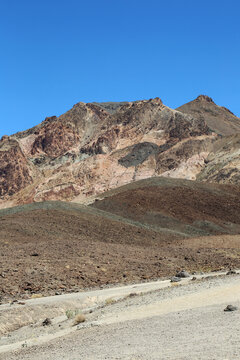 Brown and pink cliffs vertical - Death Valley National Park, California