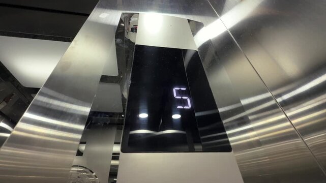 Floor Display Close show numbers going down inside steel shiny elevator