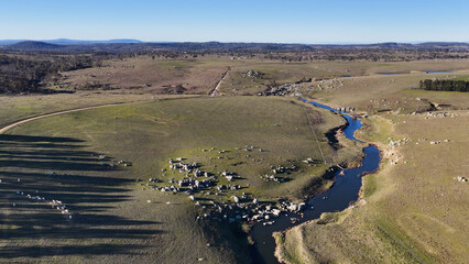 Fototapeta premium Aerial View of a Winding River Through Rural Uralla Countryside
