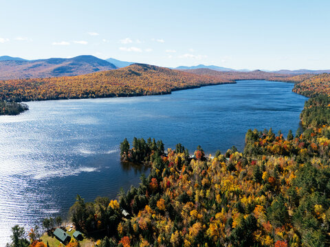 Fall Colours in the White Face Mountain ski resort and lake. Color Change, Vermont, USA.