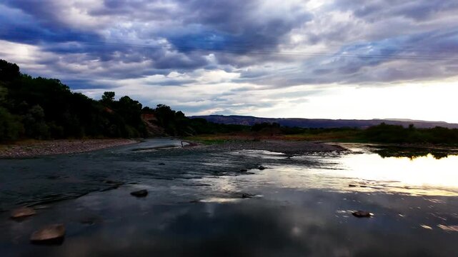 Flying under bridge over Colorado River during draught season, mid day, late summer.