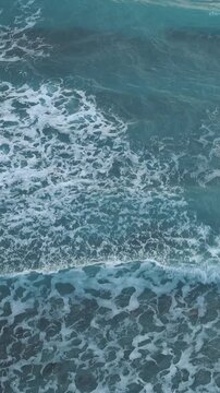 Blue Ocean Wave Surface with Moving Sea Foam Pattern