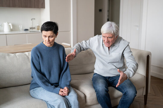 Elderly couple in conflict, man blaming woman while frail female fears speaking due to abusive dynamic. Narcissistic hysteria, emotional domination, tension, toxic reletions, psychological control