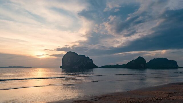 Magical sunset time-lapse over a Southern Thailand coastline, moving clouds and scenic beach view.