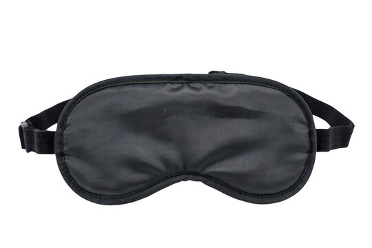 A black fabric sleep mask with an adjustable elastic strap, designed for blocking light during rest, isolated on a white background, for travel