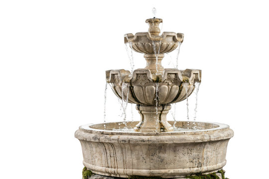 A classic three-tiered stone fountain with flowing water, featuring ornate carvings and a circular basin, isolated on a white background