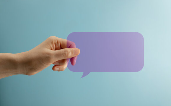 Speak speech talk truth transparent concept with hand holding purple speech bubble