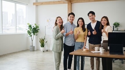 Fototapeta premium Group of Happy Young Professionals Celebrating Success in Modern Office Setting with Thumbs Up Gestures and Smiling Faces