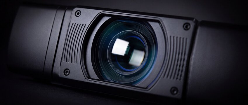 Black high definition webcam lens system close up view on dark background for video conference live streaming and security surveillance use