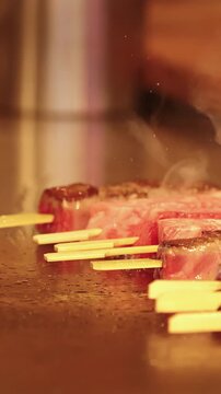 Japanese Wagyu Beef Skewers Sizzling on a Teppanyaki Grill