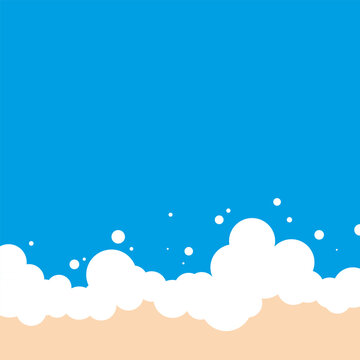 Blue ocean wave foam on sandy beach background